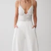 Body in pizzo trasparente con scollo a V Jasper – Avorio Body in pizzo trasparente con scollo a V Jasper – Avorio