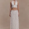 Top senza maniche con scollo all’americana plissettato Amaris – Stampa floreale a piccoli motivi Top senza maniche con scollo all’americana plissettato Amaris – Stampa floreale a piccoli motivi
