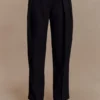 Pantaloni a vita alta plissettati Penelope – Nero Pantaloni a vita alta plissettati Penelope – Nero