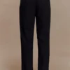 Pantaloni a vita alta plissettati Penelope – Nero Pantaloni a vita alta plissettati Penelope – Nero