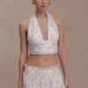 Top senza maniche con scollo all’americana plissettato Amaris – Stampa floreale a piccoli motivi Top senza maniche con scollo all’americana plissettato Amaris – Stampa floreale a piccoli motivi